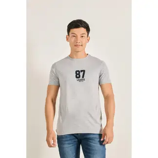 KOAJ - Camiseta manga corta unicolor con estampado en frente est HOMBRE