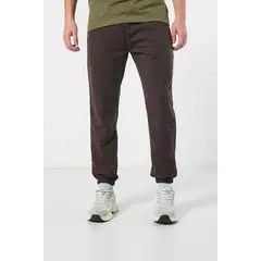 KOAJ - Pantalón jogger unicolor con elástico en bota y bolsill Hombre