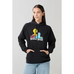 KOAJ - Buzo de Plaza Sésamo negro con manga ranglan y capota Mujer