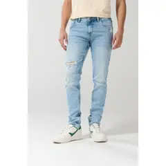 KOAJ - Jean azul claro tipo skinny tiro bajo con desgastes sut Hombre