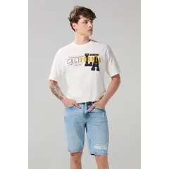 KOAJ - Bermuda de jean azul slim tiro bajo con rotos en frente Hombre