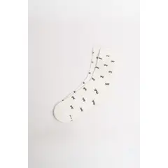 KOAJ - Medias largas crema con diseño de moños. Mujer