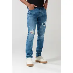 KOAJ - Jean slim tiro bajo azul medio con rotos y ajuste ceñi Hombre