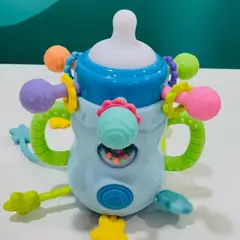AMERICAN GENERICS - Juguete para bebes asomas dientes tipo tetero