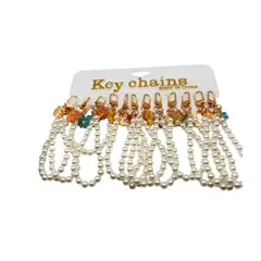 MAZUGI - Llavero Perlas Luxury con Dijes Flor y Mariposa X12