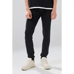 KOAJ - Jean infaltables negro skinny con tiro bajo y bolsillos Hombre